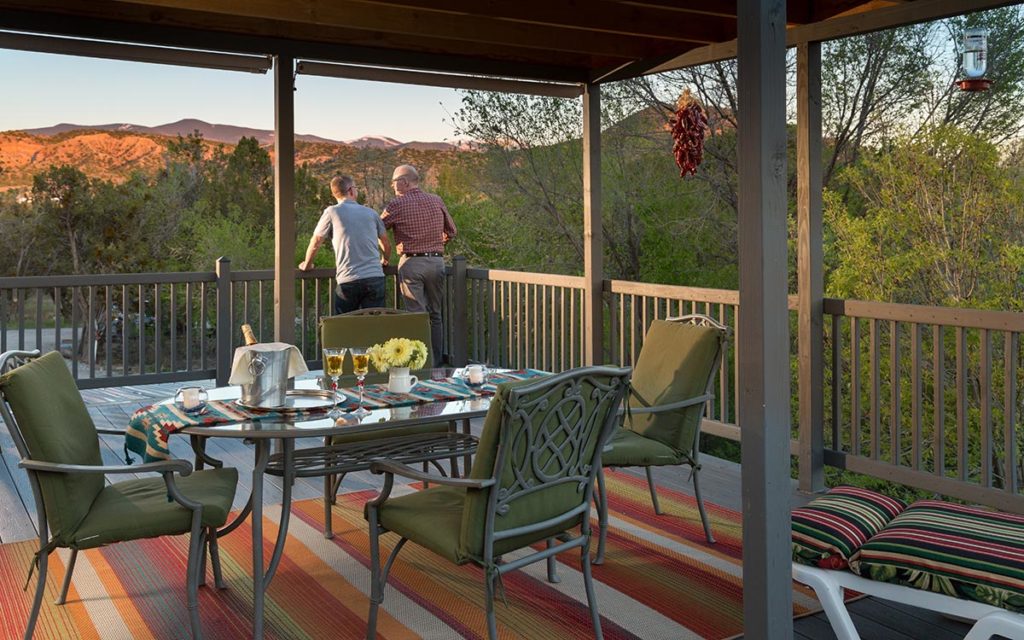 Two people taking in the view at our Bed and Breakfast in New Mexico after enjoying the best of the Santa Fe Indian Market