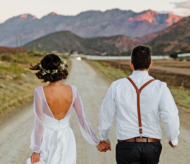 A couple during their New Mexico Elopement with the dramatic landscapes in front of them