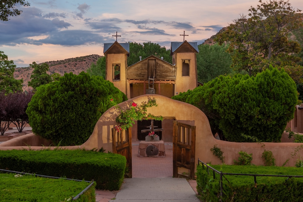 The stunning Santuario de Chimayó in Northern New Mexico is one of the best New Mexico churches to visit in 2022