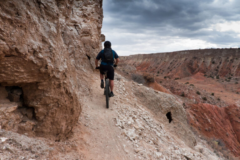 Riding through a high desert canyon on one of the best New Mexico Mountain biking trails