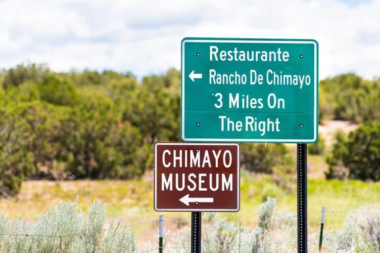 Signs on the High Road to Taos pointing to the charming town of Chimayó