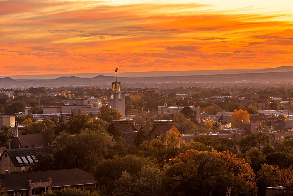 A romantic sunset concludes the day during your New Mexico honeymoon.