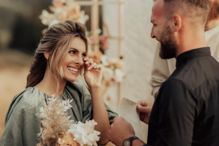 Bride wipes a tear during their elopement in New Mexico.