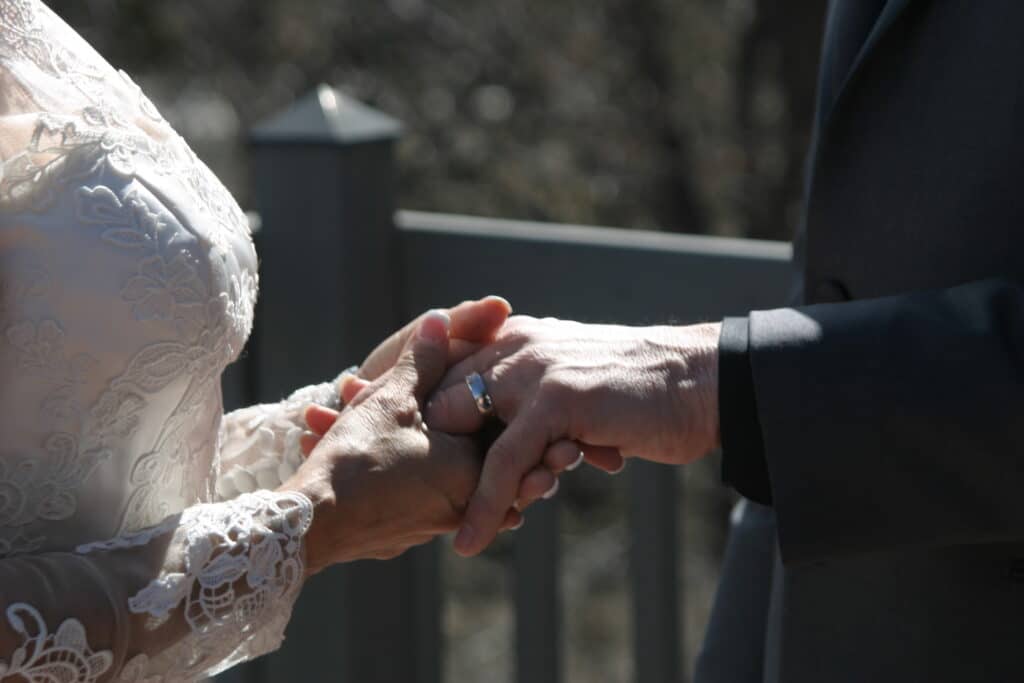 Couple holding hands during their elopement in New Mexico ceremony